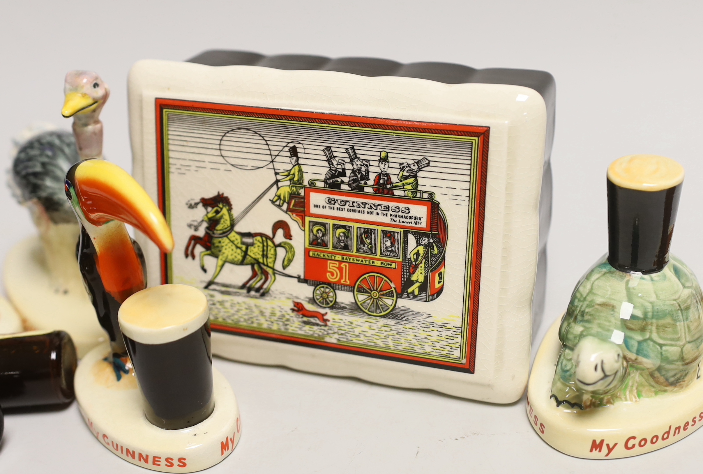 Six Carltonware Guinness advertising models, three related bottles and a rectangular box